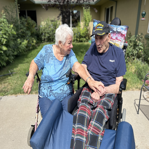 An elderly male and female sitting outside in wheelchairs. Mayers Memorial Healthcare District Launches New Commercial Highlighting the Theme of Gratitude.